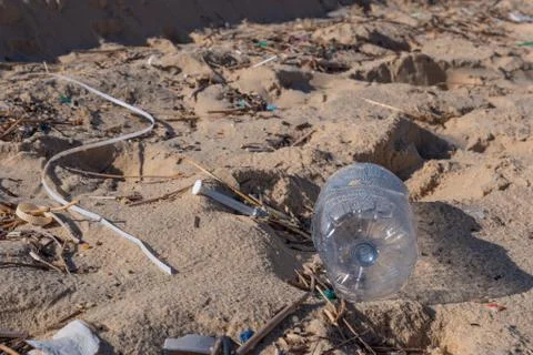 Plastic bottle on the beach, pollution Stock-Fotos