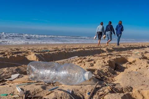 Plastic bottle on the beach, pollution Stock Photos