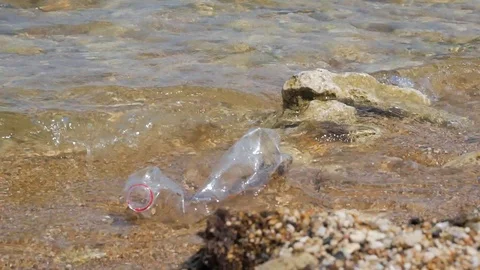 Plastic bottle on the beach. Rubbish Plastic Bottle Left on the Beach Stock Footage 121741847