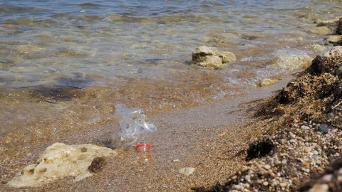 Plastic bottle on the beach. Rubbish Plastic Bottle Left on the Beach Stock Footage 121742133