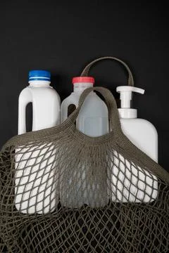 Plastic bottle on black background. High density polyethylene packaging for r Stock Photos