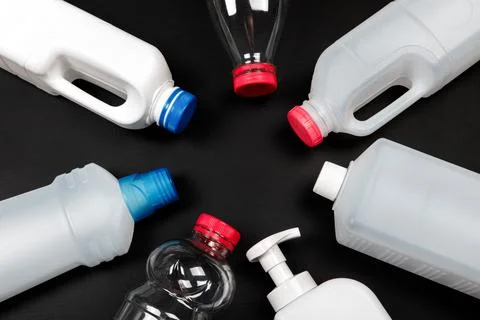 Plastic bottle on black background. High density polyethylene packaging for r Stock Photos