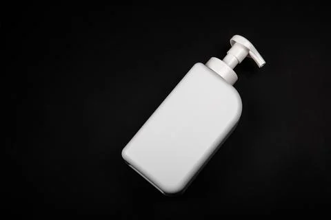 Plastic bottle on black background. High density polyethylene packaging for r Stock Photos