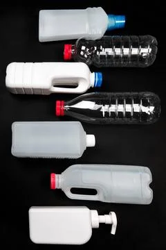 Plastic bottle on black background. High density polyethylene packaging for r Stock Photos