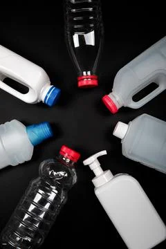 Plastic bottle on black background. High density polyethylene packaging for r Stock Photos