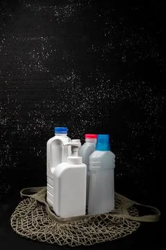 Plastic bottle on black background. High density polyethylene packaging for r Stock Photos