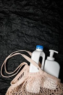 Plastic bottle on black background. High density polyethylene packaging for r Stock Photos