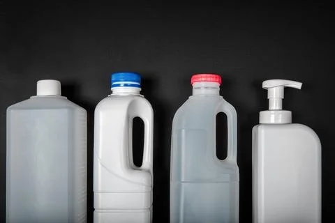 Plastic bottle on black background. High density polyethylene packaging for r Stock Photos