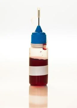 Plastic bottle with blood sample, doping medical concept Stock Photos