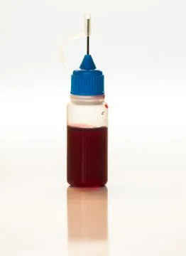Plastic bottle with blood sample, doping medical concept Stock Photos