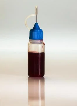 Plastic bottle with blood sample, doping medical concept Foto stock