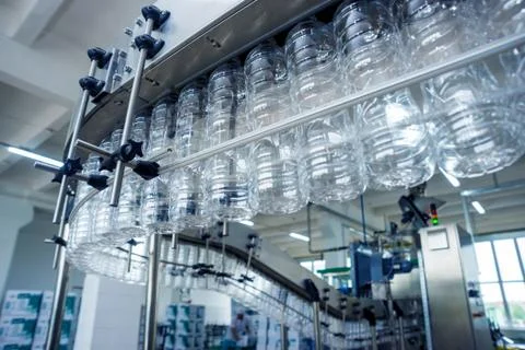 The plastic bottle blowing machine. PET preforms for blowing of plastic bottles Stock Photos