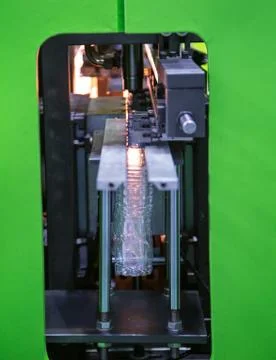Plastic bottle blowing machine Stock Photos