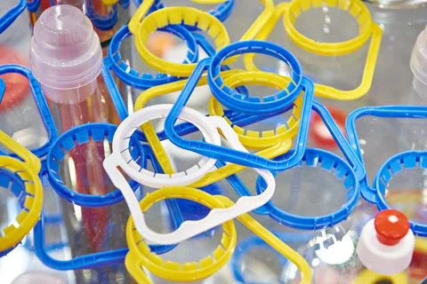 Plastic bottle caps and cap holders Stock Photos