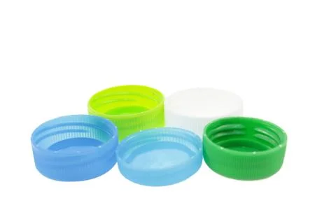 Plastic bottle caps isolated against a white background Stock Photos