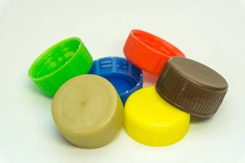 Plastic bottle caps on a white background Stock Photos