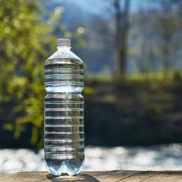 Plastic bottle with clean drinking water. Stock Photos