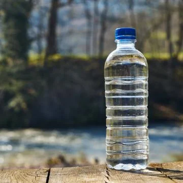 Plastic bottle with clean drinking water. Stock Photos