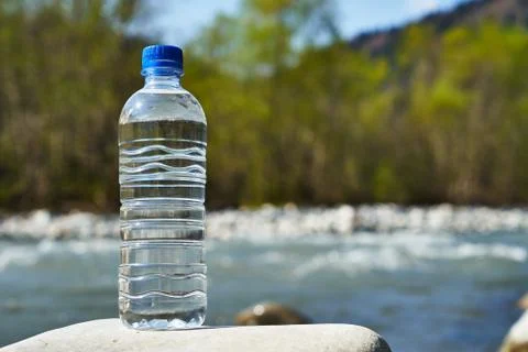Plastic bottle with clean drinking water. Stock Photos