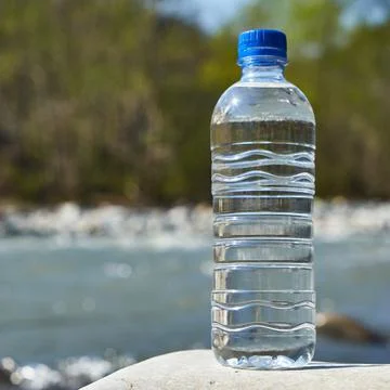 Plastic bottle with clean drinking water. Stock Photos
