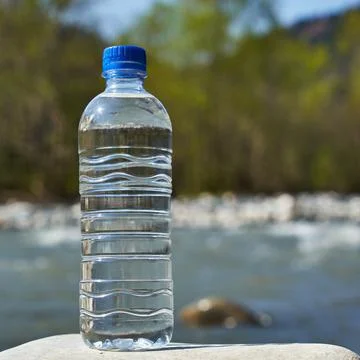 Plastic bottle with clean drinking water. Stock Photos