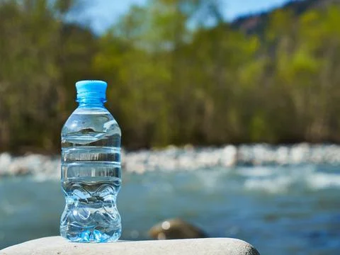 Plastic bottle with clean drinking water. Stock Photos