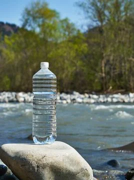 Plastic bottle with clean drinking water. Stock Photos