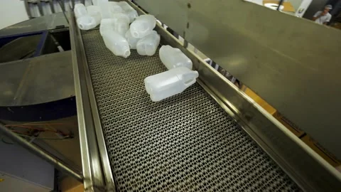 Plastic bottle conveyor, automated distribution line Stock Footage 135409818