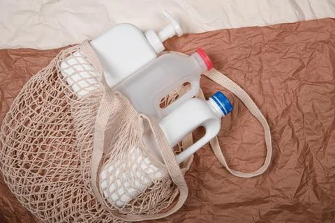 Plastic bottle on craft background. High density polyethylene packaging for r Stock Photos