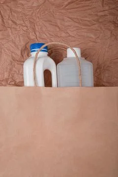 Plastic bottle on craft background. High density polyethylene packaging for r Stock Photos