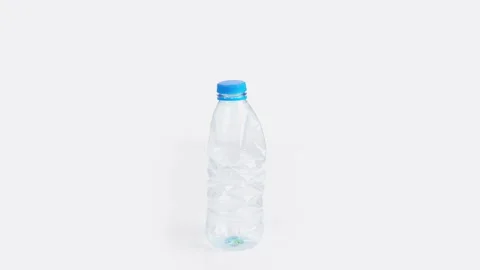 Plastic bottle crushing time lapse on white background Stock Footage 170002574