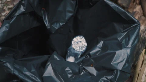 Plastic Bottle Falling into Trash Bin – Cinematic Close-Up in 4K 스톡 동영상 312309978