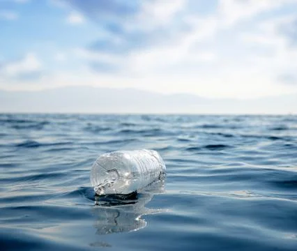 Plastic bottle floating in the ocean. Stock Photos