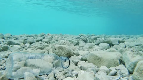 A plastic bottle floats in the sea. Plastic Bottle Swims Underwater. Stock Footage 160714959