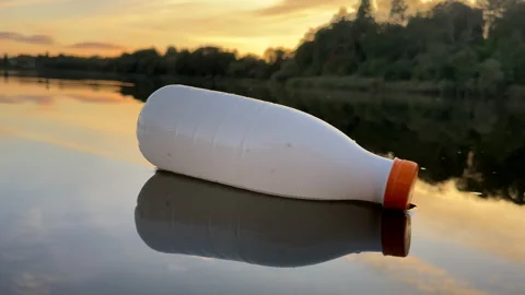 Plastic bottle garbage on sea shore lake. Stock Footage 251529755