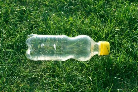 Plastic bottle on grass Stock Photos