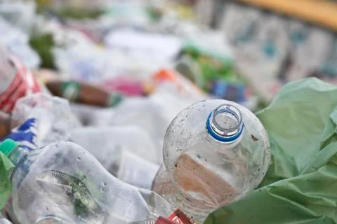 Plastic bottle on the ground and more trash Stock Photos