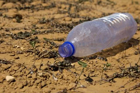Plastic bottle on the ground Stock Photos