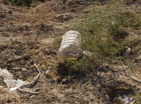 Plastic bottle on the ground Stock Photos