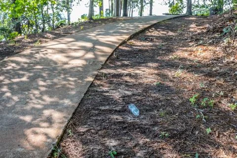 Plastic bottle laying on the ground Stock Photos