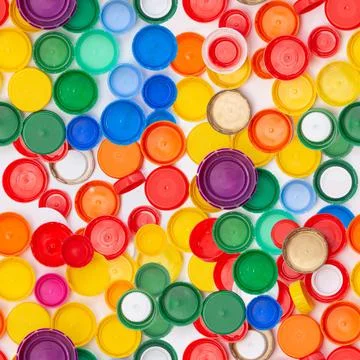 Plastic bottle lid seamless background pattern, rainbow color, remove cap before Stock Photos