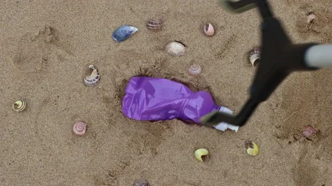 Plastic bottle litter on Woolacombe beach in Devon, UK Stock Footage 170307522