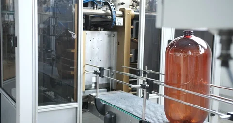 Plastic bottle manufacturing line. Close up of production line of beer bottles. Stock-Footage 120331094