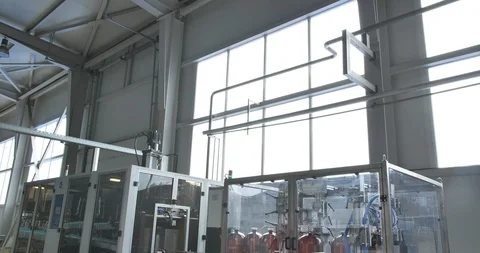 Plastic bottle manufacturing line. Close up of production line of beer bottles. Видео 120333950