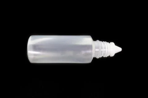 Plastic bottle of normal saline isolated on black background. Stock Photos