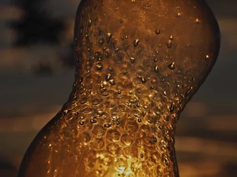 Plastic bottle pierced by the sun's rays 写真素材