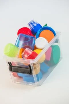 Plastic bottle screw caps in box isolated on white 스톡 사진