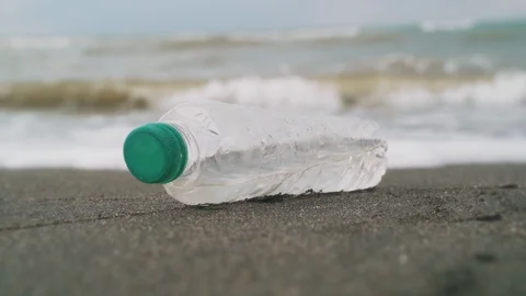 Plastic bottle on the seashore Stock Footage 115843279