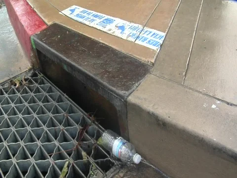 Plastic bottle in storm drain Video stock 609723