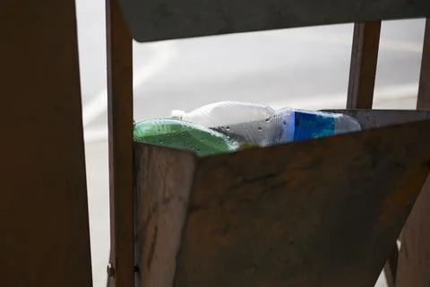 Plastic bottle into the tank. close up Stock Photos
